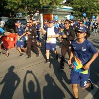 mantan-atlet-hingga-menteri-arak-obor-di-makassar