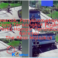 heroik-penyelamatan-orang-tersangkut-palang-pintu-yang-hampir-terlindas-kereta