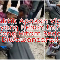 heboh-pertunjukan-sosok-manusia-dipocong-kain-hitam-sulap-atau-settingan-kesurupan