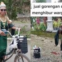 penjual-gorengan-ini-berbusana-serba-hijau-dengan-mahkota