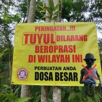 respons-kades-soal-warga-pasang-spanduk--tuyul--dilarang-beroperasi