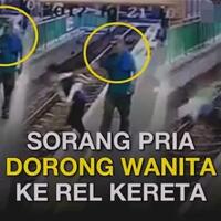 parah-seorang-pria-jorokin-cewek-ke-rel-kereta