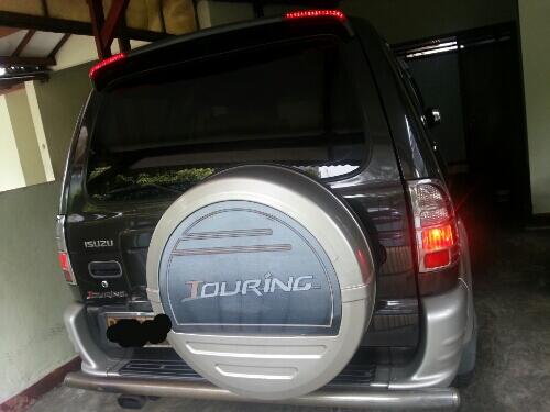 Isuzu Panther Touring Thn. 2003 / Coklat Tua