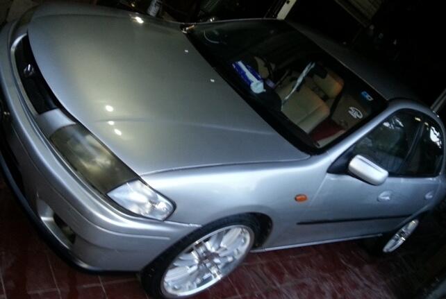 mazda 323 familia 1.8 2000 jatibening bekasi