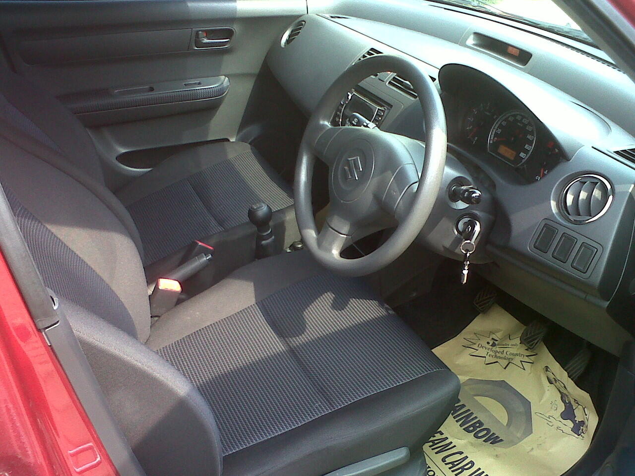 jual suzuki swift ST 2009 warna merah metalic