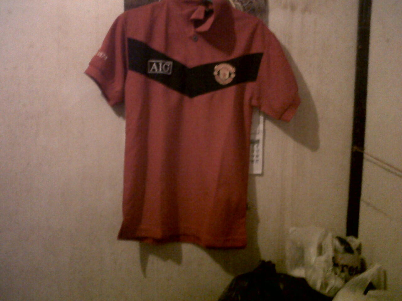 Polo MU Merah