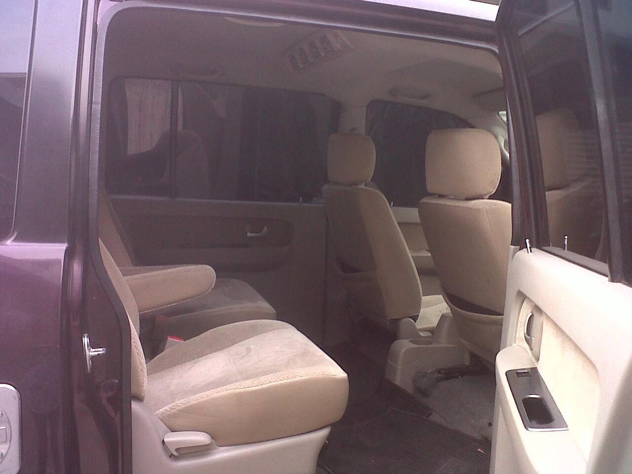 Suzuki APV Arena GX MT tahun 2009 merah maroon