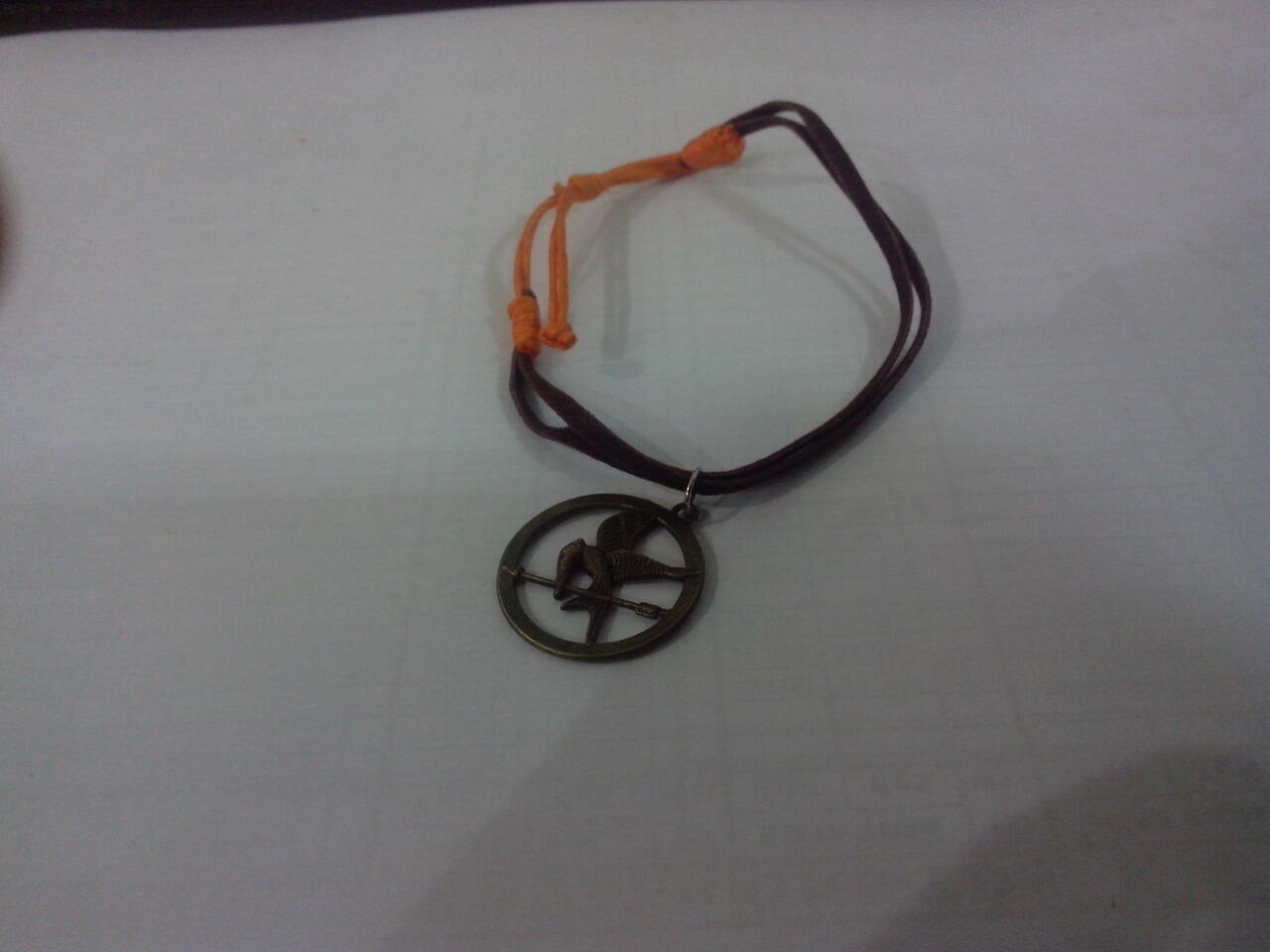 aksesoris THE HUNGER GAMES - Mocking Jay