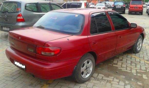 TIMOR DOHC 2000 MERAH METALIK KONDISI SANGAT BAGUS SIAP UNTUK MUDIK