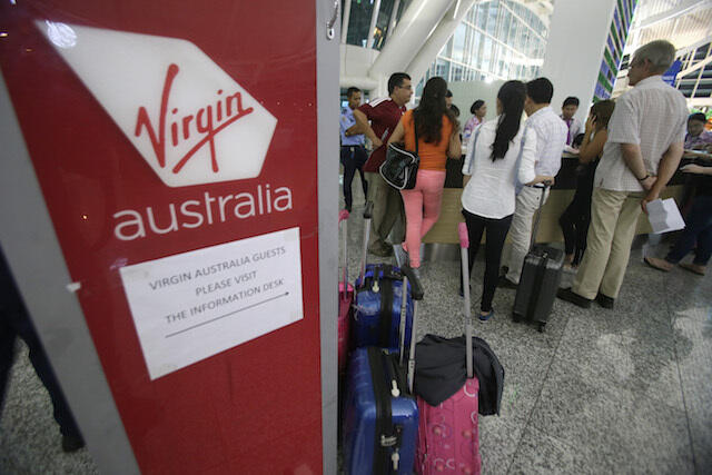 IN PHOTOS: Tourists stranded, flights canceled in Bali