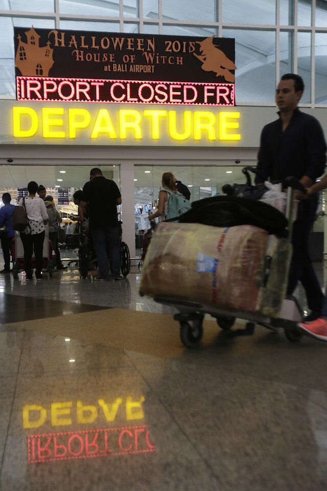 IN PHOTOS: Tourists stranded, flights canceled in Bali