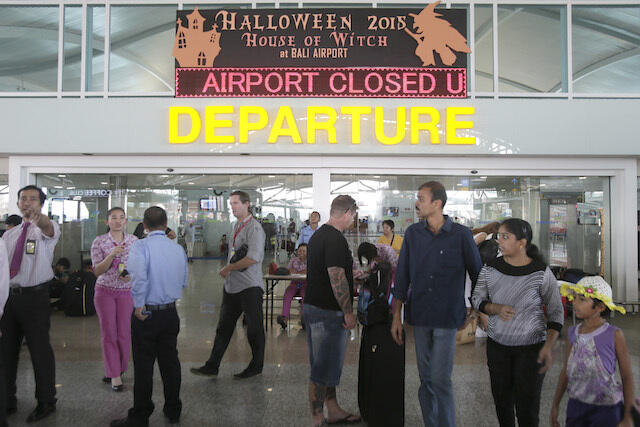 IN PHOTOS: Tourists stranded, flights canceled in Bali