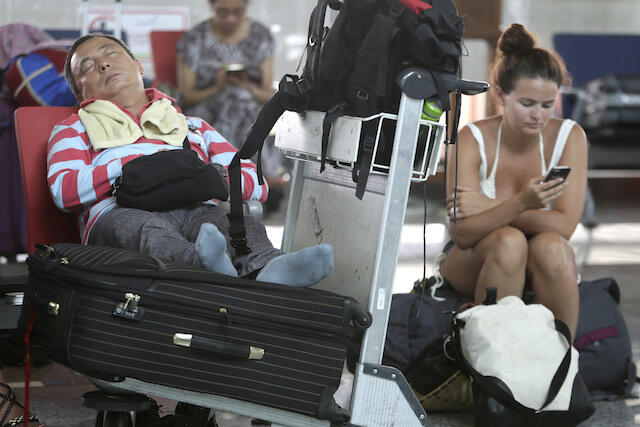 IN PHOTOS: Tourists stranded, flights canceled in Bali
