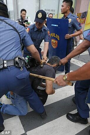 Philippines police ram protesters with a TRUCK during demonstration outside US embass