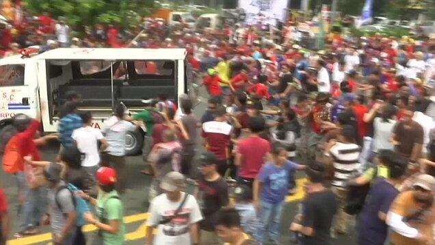 Philippines police ram protesters with a TRUCK during demonstration outside US embass