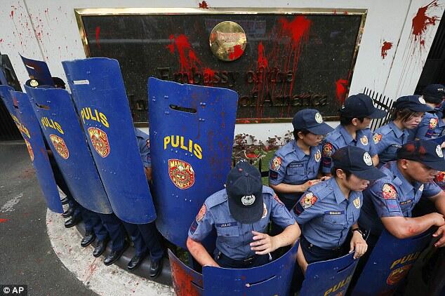 Philippines police ram protesters with a TRUCK during demonstration outside US embass