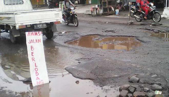 Tambal Sulam Jalan Aspal