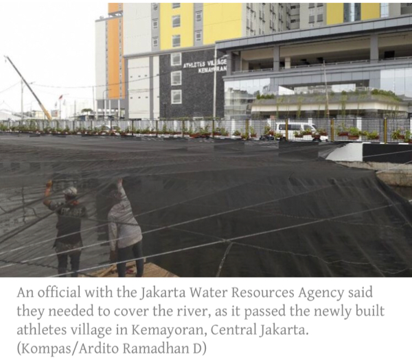 Too ugly, too smelly: Jakarta covers up ‘Black River’ for Asian Games