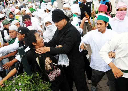 Polisi: Insinyur S Salin Data di Laptop Ninoy untuk Diserahkan ke Munarman