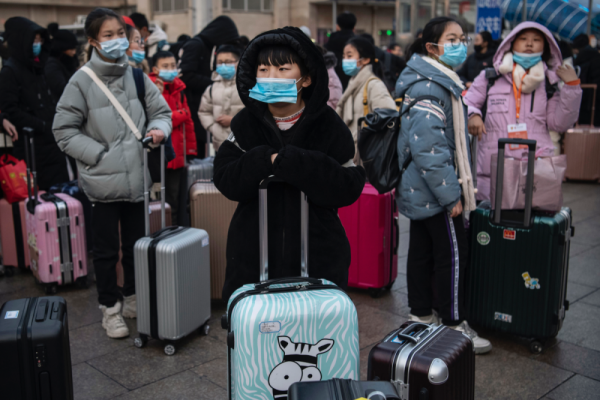 10 Foto Mudik Imlek di Tiongkok di Tengah Penyebaran Virus Corona