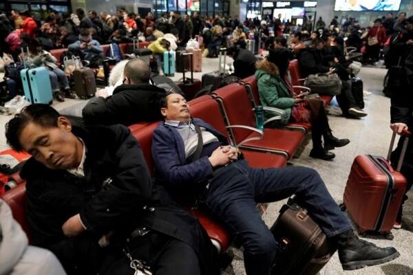 10 Foto Mudik Imlek di Tiongkok di Tengah Penyebaran Virus Corona