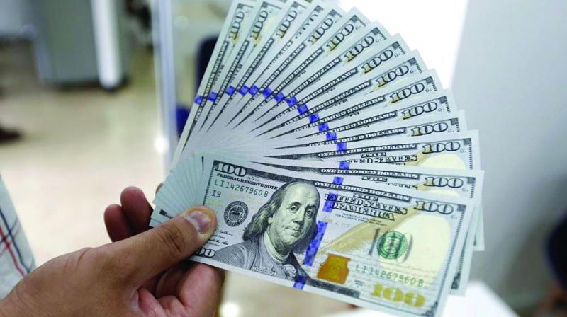 Dolar AS Melemah Tipis, Investor Nantikan Proyeksi Kebijakan Fed
