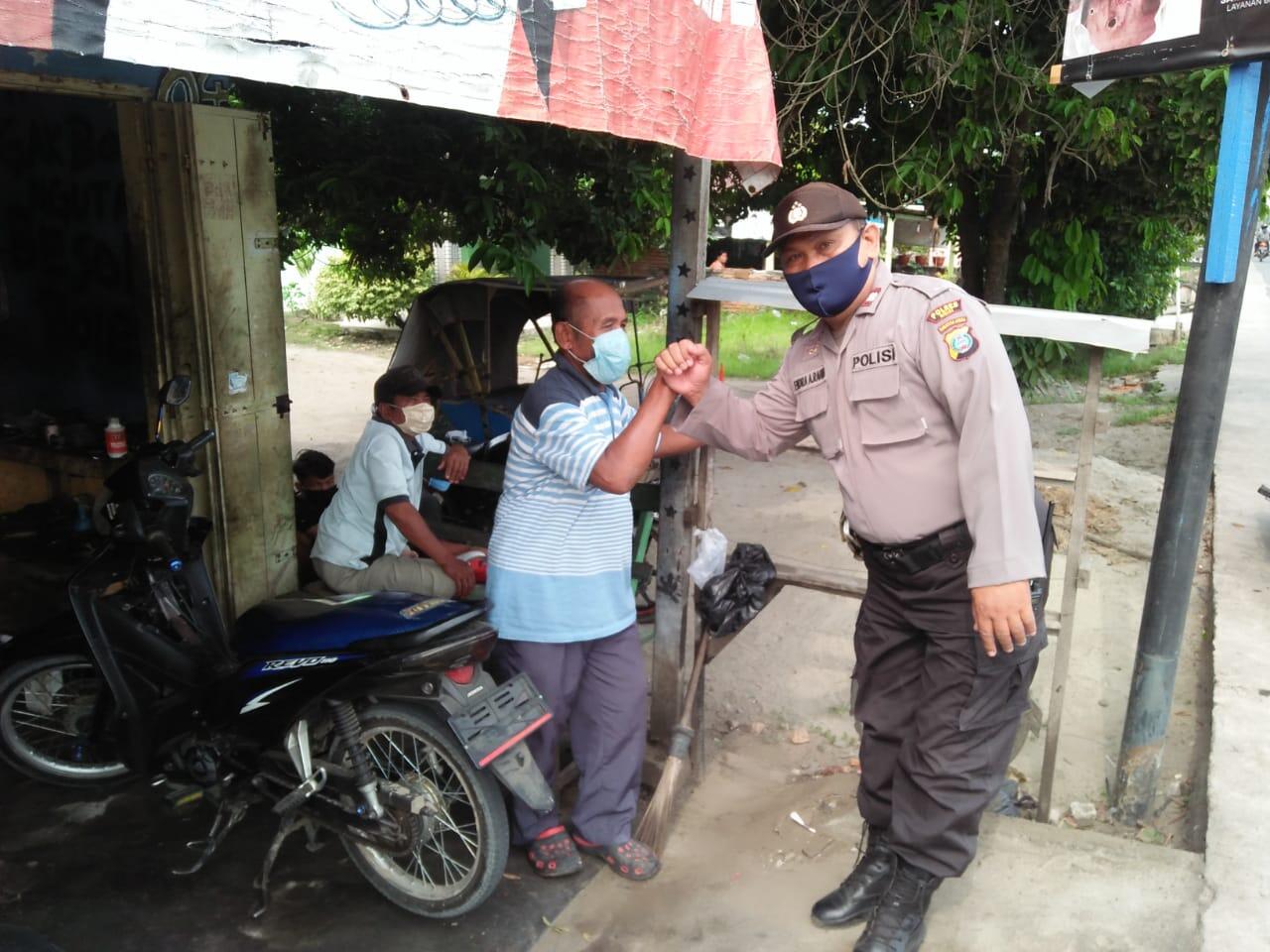 Polsek Binjai Patroli Bagikan Masker Cegah Virus Corona