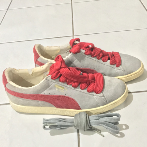 grey and red puma shoes